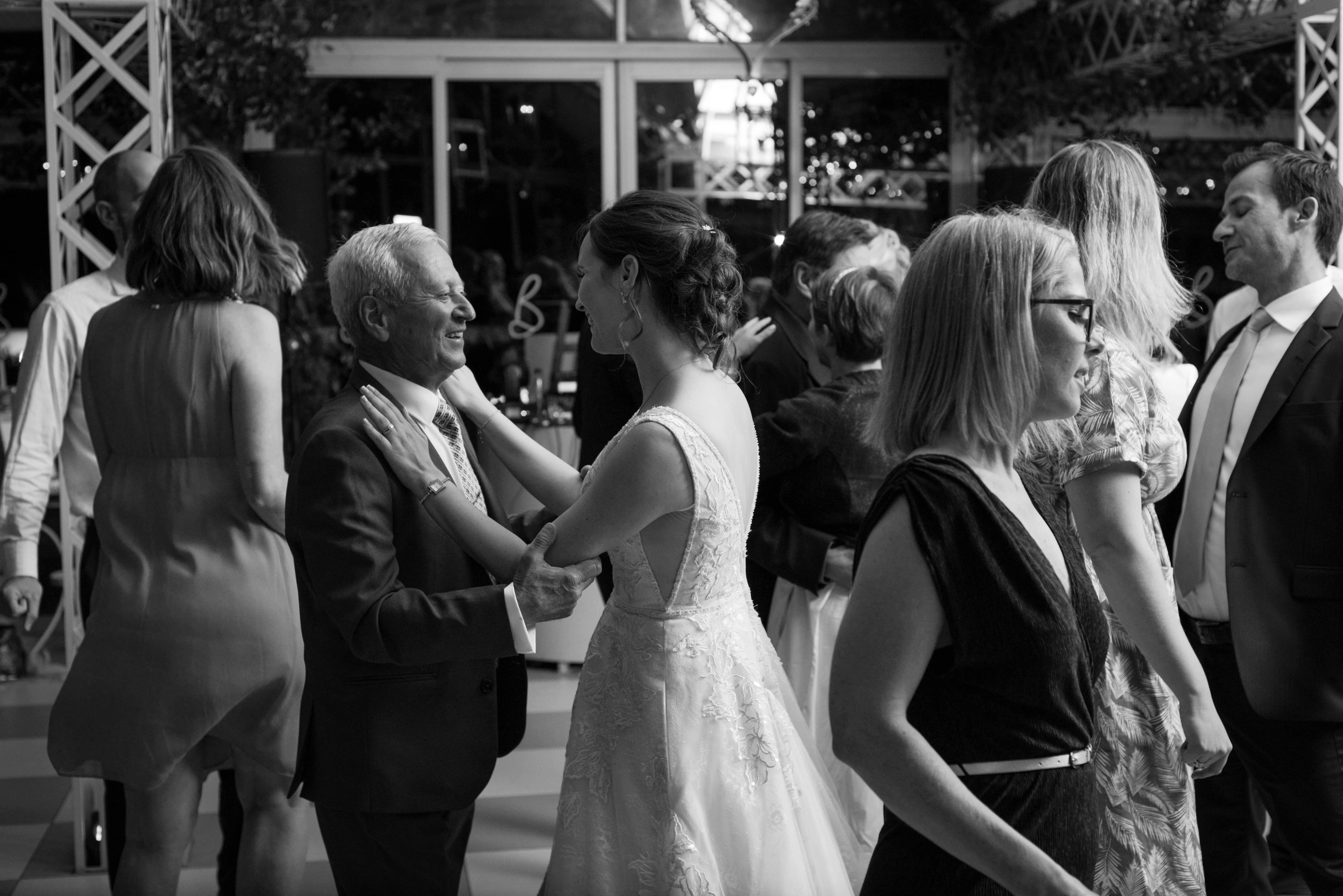 A bride and her father embracing at her wedding in Paarl.