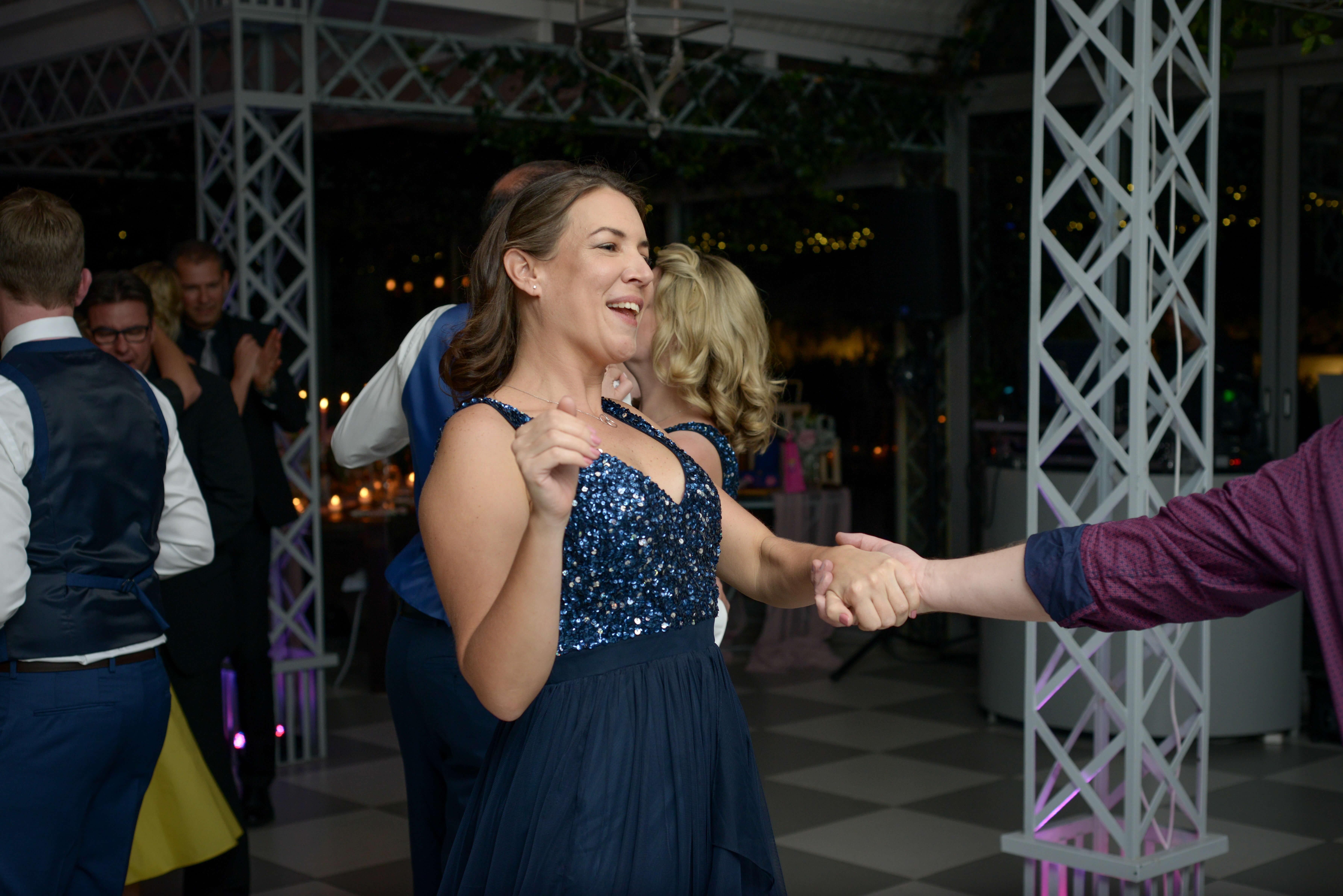 A woman smiling and reacting joyfully to her favourite song.