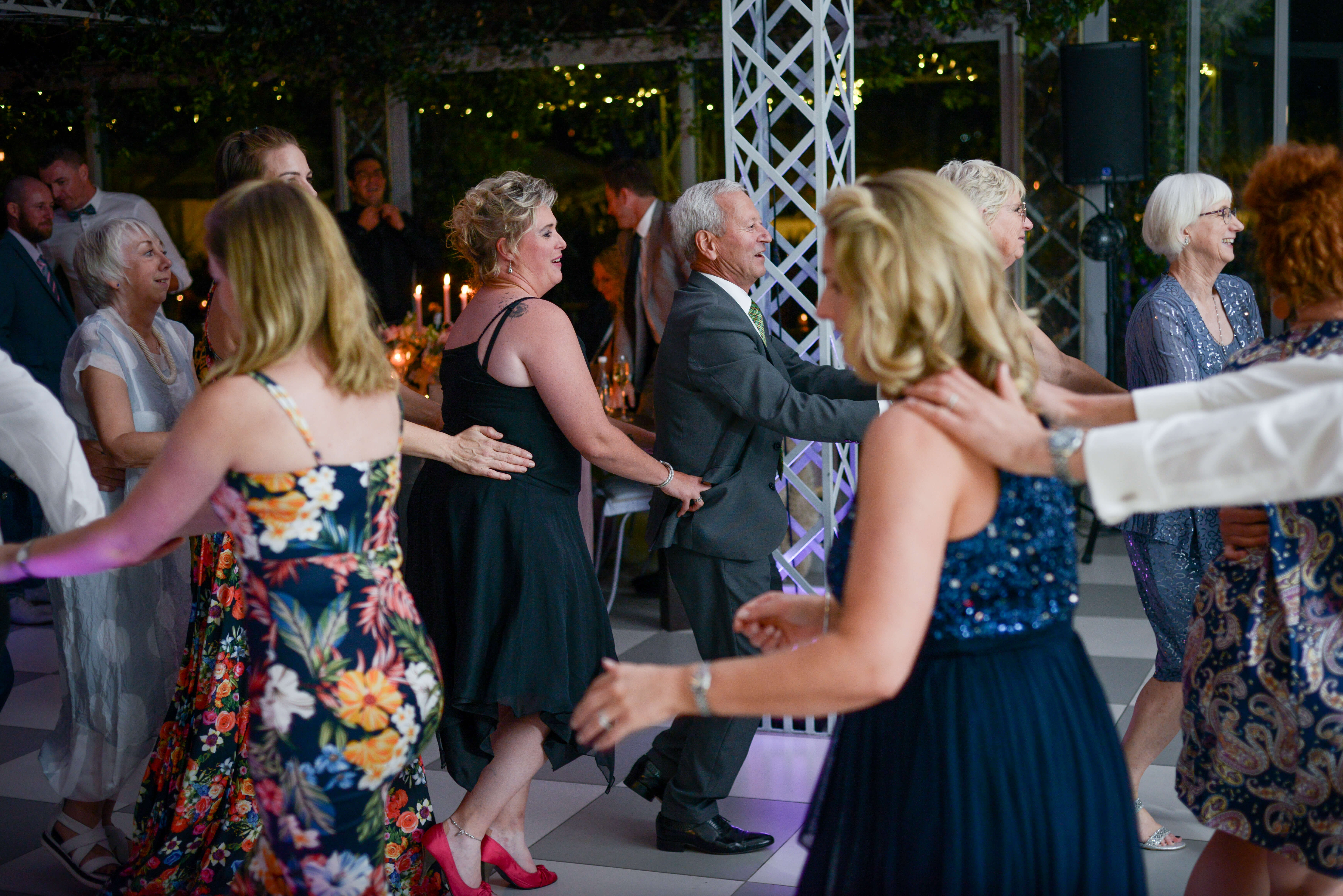A massive crowd doing the locomotion at a beautiful Belair wedding.