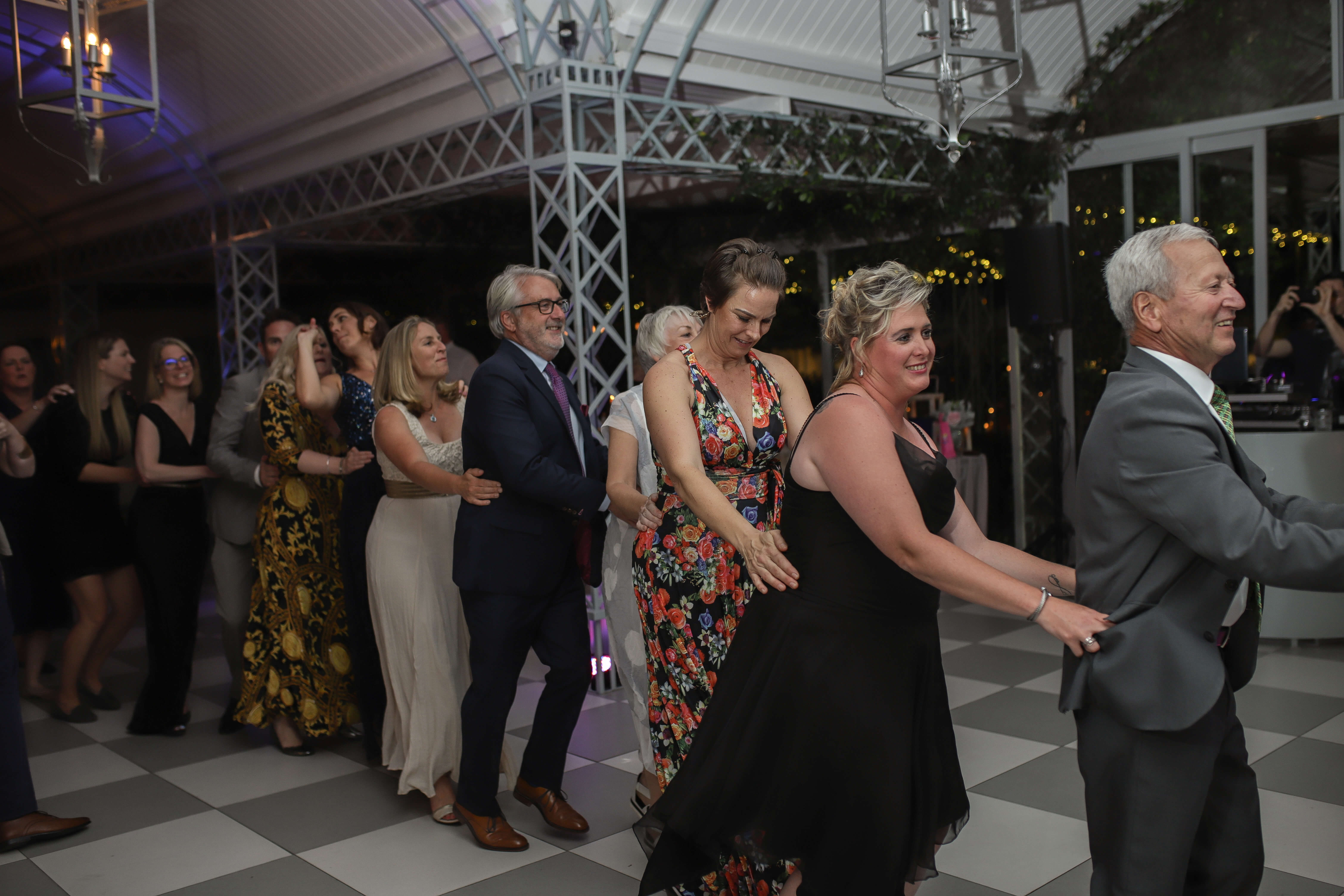 A crowd doing the locomotion to the locomotion by Kylie.
