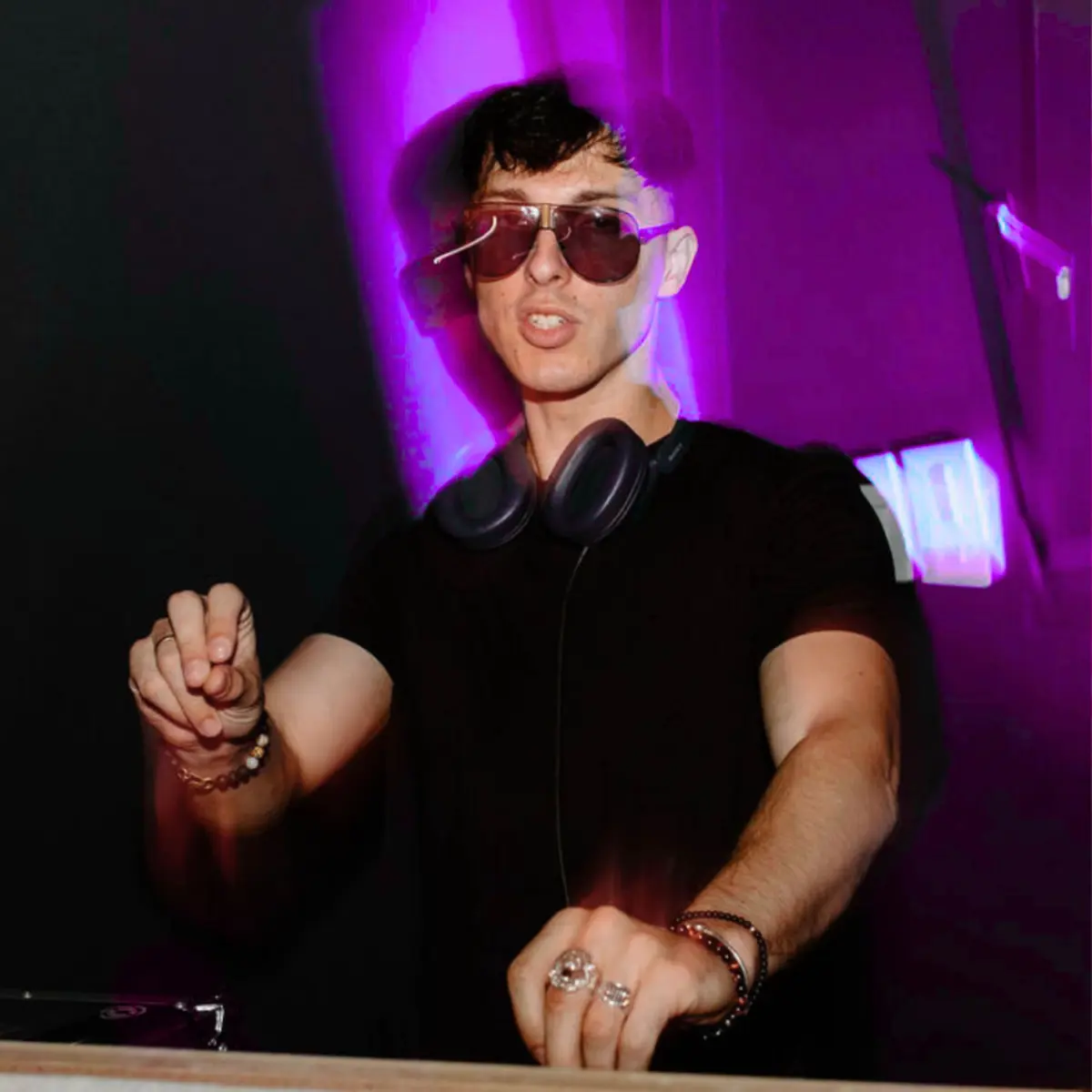 Liam at the decks under purple lights