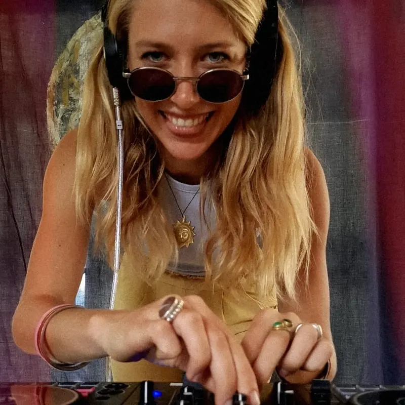 Victoria at the decks with her headphones on