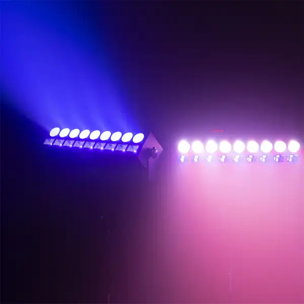 Two UV bars casting violet light through haze over a dance floor