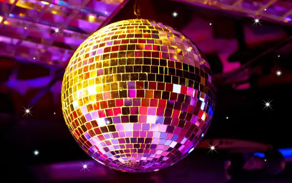 Mirror disco ball scattering gold and pink light