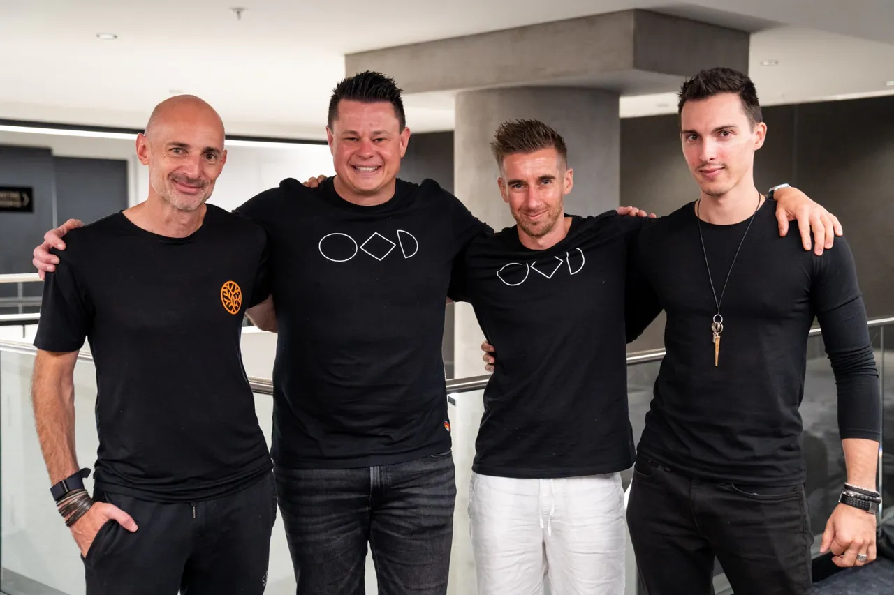 Liam with three of the event's hosts, arms round each other
